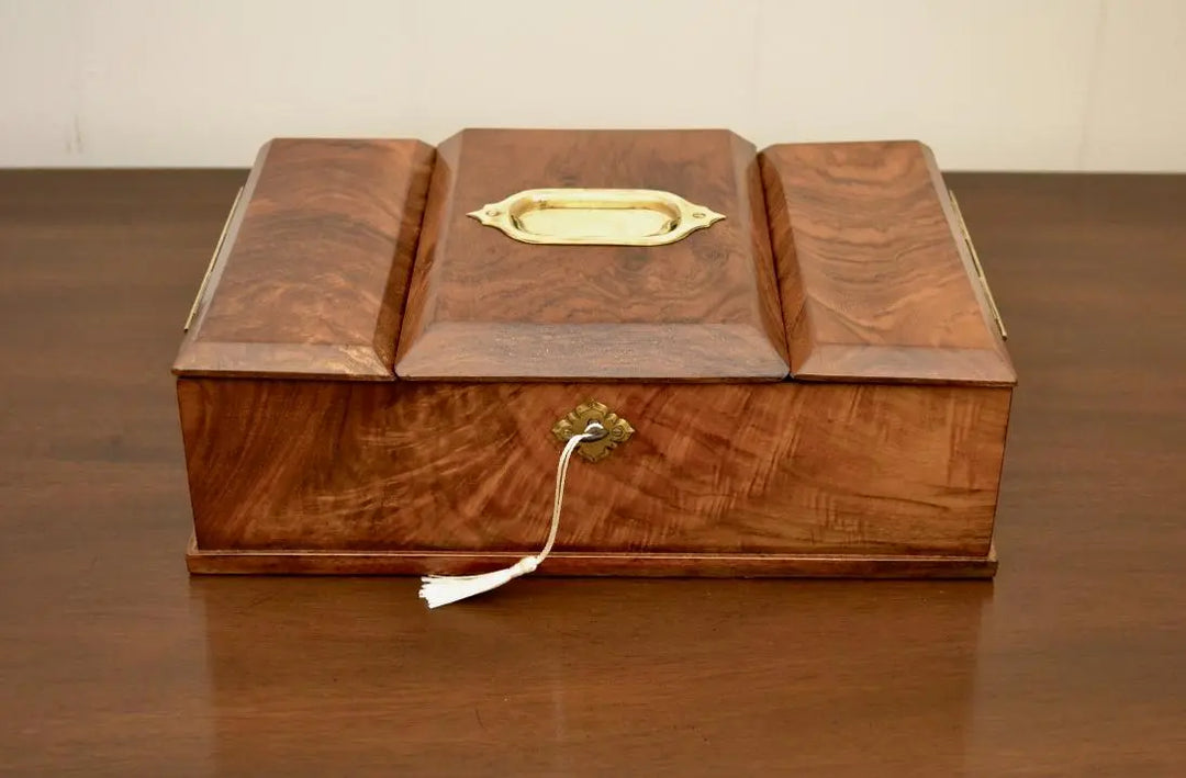 Antique walnut tea caddy box with brass handle and key tassel