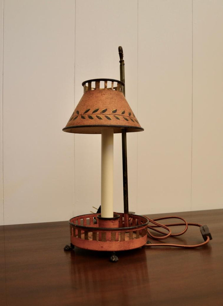 ngled side view of painted Bouillotte-style lamp with adjustable shade and circular base