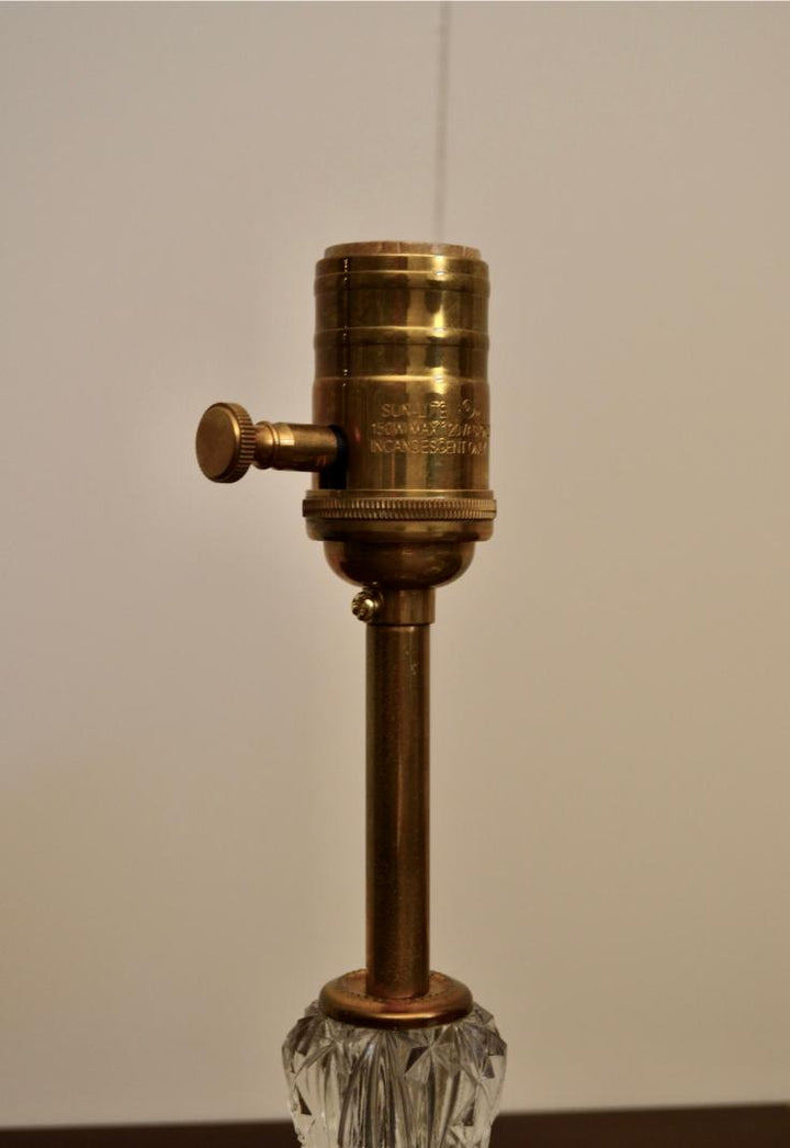 Detailed_view_of_brass_lamp_socket_with_rotary_switch_and_etched_markings