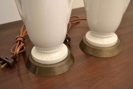 Close-up of ceramic urn lamp bases with round brass footings
