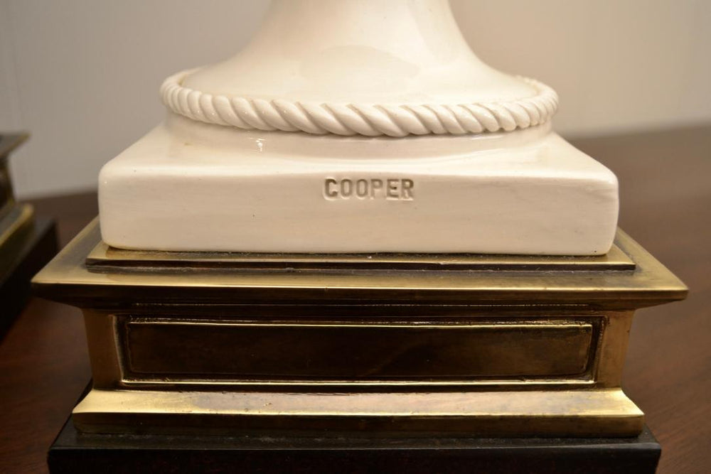 Close-up of the Cooper stamp on the ceramic table lamp base by Frederick Cooper, highlighting the maker's mark and rope detail.