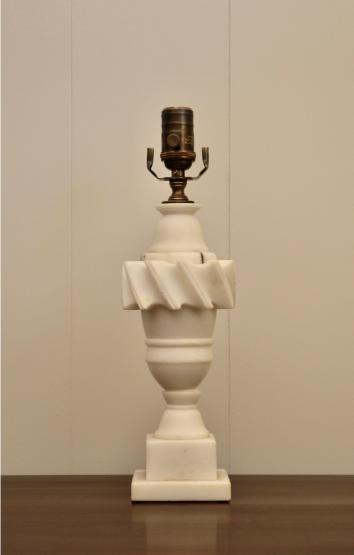 Full front view of sculpted white marble table lamp with Art Deco style base