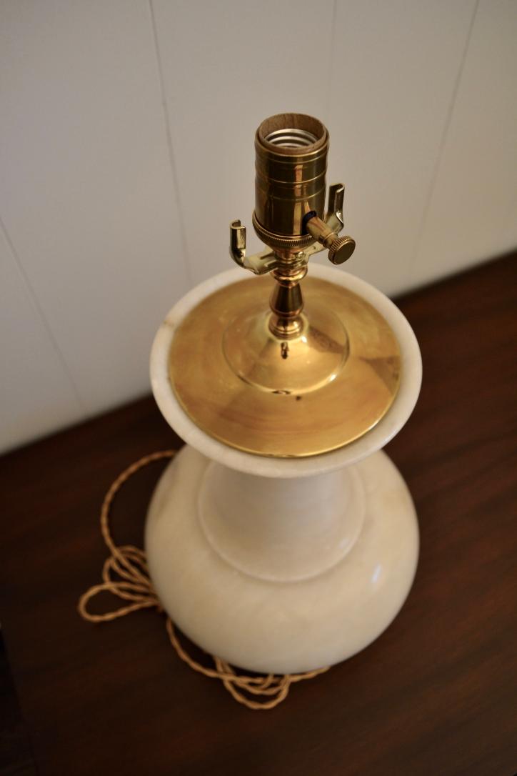 Top view of vintage alabaster table lamp with brass socket and harp holder