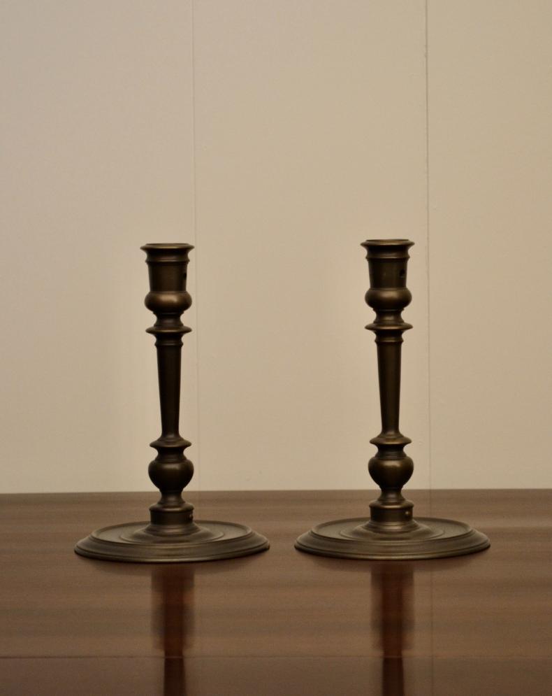 Pair of vintage bronze candlestick holders without candles