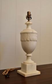 Angled side view of antique white alabaster urn lamp showing carved details and original twisted cord