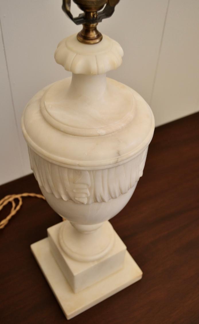 Top-down view of neoclassical alabaster urn lamp showing detailed lid carving and elegant proportions